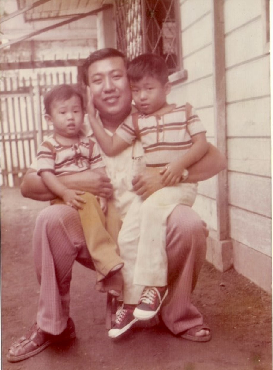 Maning with two children in a family photo