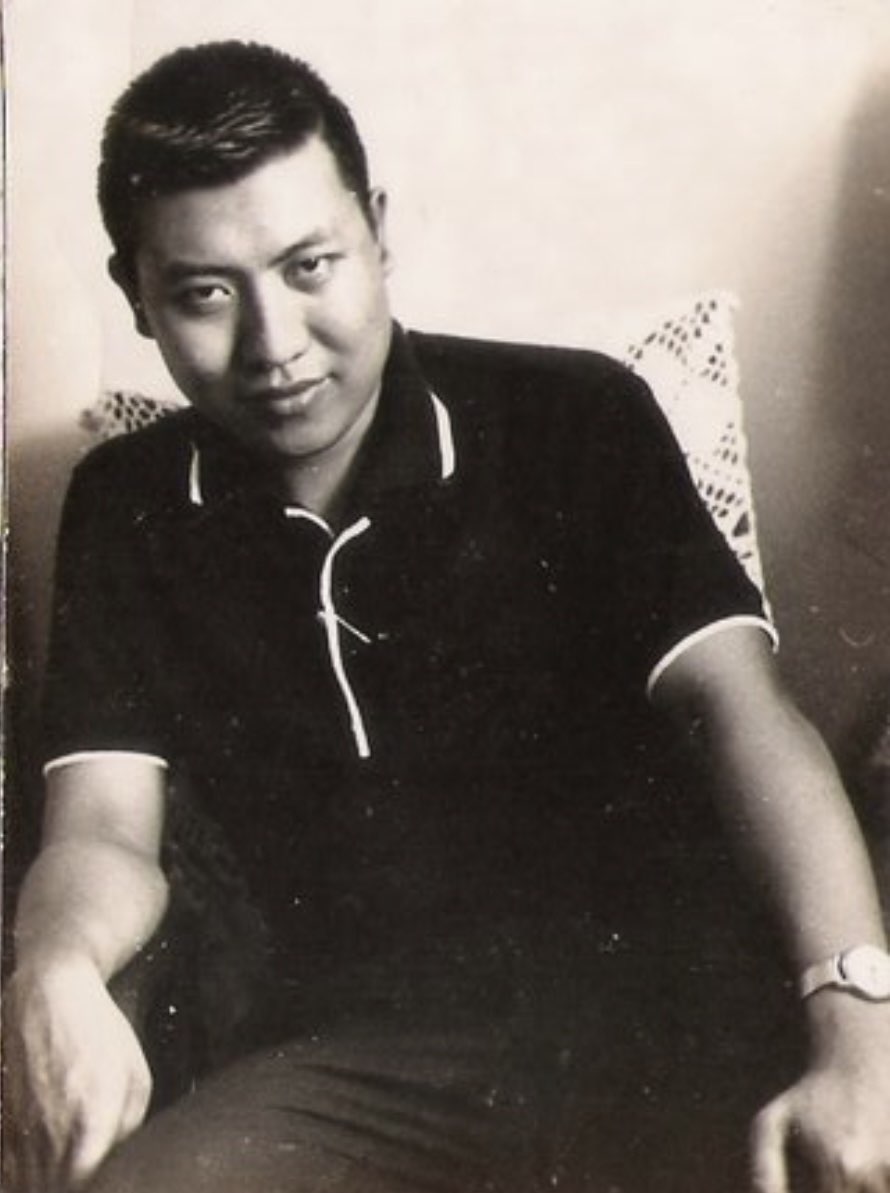 Young Manuel 'Maning' S. Satorre Jr. seated for a black-and-white portrait